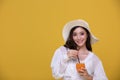 Portrait Asian beautiful happy young woman with sunglasses  smiling cheerful and Holding a glass of orange juice in summer and Royalty Free Stock Photo