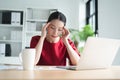 Portrait of Asian beautiful office woman having headaches, stressful of work, depressed or having a fever while working at the