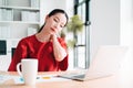 Portrait of Asian beautiful office woman having neckaches, stressful of work, depressed or having a fever while working at the