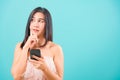Portrait asian beautiful woman her holding mobile phone her confused and thinking Royalty Free Stock Photo