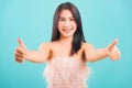 Portrait asian beautiful woman smiling her showing two hand finger thumbs up and looking to camera Royalty Free Stock Photo