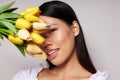 Portrait Asian beautiful young woman flowers spring posing light background unaltered Royalty Free Stock Photo