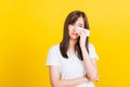 Woman sad she crying wiping tears from eyes with a tissue Royalty Free Stock Photo