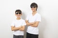 Portrait of Asian boy and caucasian teen on white background.