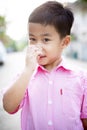 Portrait of asian boy children standing outdoor relaxing emotion Royalty Free Stock Photo