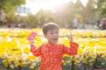 Portrait of a Asian boy on traditional festival costume. Cute little Vietnamese boy in ao dai dress smiling. Tet holiday. Lunar Royalty Free Stock Photo