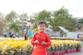 Portrait of a Asian boy on traditional festival costume. Cute little Vietnamese boy in ao dai dress smiling. Tet holiday. Lunar Royalty Free Stock Photo
