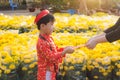 Portrait of a Asian boy on traditional festival costume. Cute little Vietnamese boy in ao dai dress smiling. Tet holiday. Lunar Ne