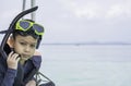 Portrait Asian Boy wearing a life jacket and scuba diving Background sea Royalty Free Stock Photo