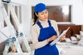 Portrait of an asian builder woman who checks completed work on