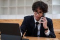 Portrait of asian business man young smiling cheerful entrepreneur in casual office making phone call while working with Royalty Free Stock Photo