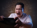 Asian Businessman Working on Laptop at the Office, Tired Stress Gesture Royalty Free Stock Photo