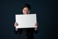 Portrait of Asian businesswoman holding whiteboard