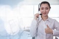 Portrait Asian callcenter operator thumbs up. Helpdesk support phone call customer care female staff smiling with headset good