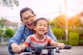 Portrait of asian children riding bicycle with mother smiling face happiness emotion Royalty Free Stock Photo