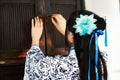 Portrait of Asian Chinese girl in traditional dress, wear blue and white porcelain style Hanfu, open ancient cupboard Royalty Free Stock Photo