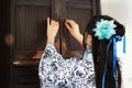 Portrait of Asian Chinese girl in traditional dress, wear blue and white porcelain style Hanfu, open ancient cupboard Royalty Free Stock Photo