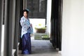 Portrait of Asian Chinese girl in traditional dress, wear blue and white porcelain style Hanfu