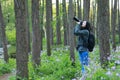 Portrait of a Asian Chinese nature woman photographer carry her camera screen in a spring park forest Royalty Free Stock Photo