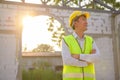 Portrait of An Asian Engineering man wearing safety helmet checking construction site analyzing about project progress Royalty Free Stock Photo