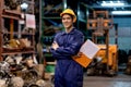 Portrait of Asian factory man or warehouse worker with smiling and action of arm crossed with confident in automotive parts