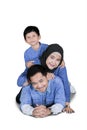 Asian family lying together on studio Royalty Free Stock Photo