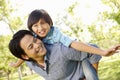 Portrait Asian father and son playing in park Royalty Free Stock Photo