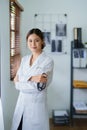 Portrait of an Asian female doctor smiling happily holding a stethoscope after a break from work Royalty Free Stock Photo