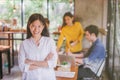 Portrait of asian female leader of working team coworking office ,Smiling of happy chinese girl in modern office Royalty Free Stock Photo