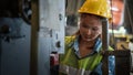 Portrait of asian female mechanic engineer working with steel drilling machine in metal work manufacturing factory Royalty Free Stock Photo