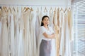 Portrait of asian woman wedding dress store owner,Beautiful dressmaker in shop and small business Royalty Free Stock Photo