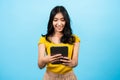 Portrait, asian girl long hair wearing fitted shirt, stood chatted with friends on an online app in laptop Royalty Free Stock Photo