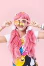 Portrait of an Asian girl in a pink wig in a kawai style Royalty Free Stock Photo