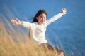 Portrait of asian girl relaxing emotion sitting in grass field a Royalty Free Stock Photo