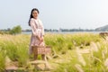 Portrait of an Asian girl seeking calm and tranquillity in a floral garden