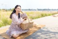 Portrait of an Asian girl seeking calm and tranquillity in a floral garden