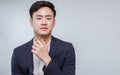 Portrait of Asian handsome business man wearing formal suit, cross his arms and smiling with confident with white background Royalty Free Stock Photo