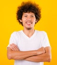 Portrait of Asian handsome man with curly hair with arms crossed Royalty Free Stock Photo