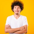 Portrait of Asian handsome man with curly hair with arms crossed Royalty Free Stock Photo