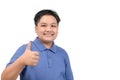 Portrait of asian happy fat boy showing thumbs up gesture, isolated Royalty Free Stock Photo