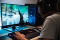 Portrait of asian happy gamer boy playing video games online on Royalty Free Stock Photo