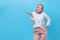 Portrait Asian happy young woman smiling cheerful and looking at camera isolated on blue background Royalty Free Stock Photo