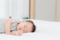 Portrait of asian little baby girl sleeping on bed in the bedroom at home, newborn napping with cozy and relax.