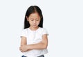 Portrait of Asian little child girl with arms crossed and acting all sad over white background with looking down. Person with