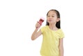 Portrait asian little child girl eating ice cream cone isolated on white background Royalty Free Stock Photo
