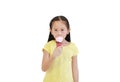 Portrait asian little child girl eating ice cream cone isolated on white background Royalty Free Stock Photo