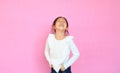 Portrait asian little child girl laughing  on pink background. Happy smiling kid expressive facial expressions Royalty Free Stock Photo