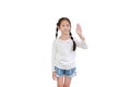 Portrait asian little child girl shows palm hand isolated on white background. Kid gestures five fingers with looking camera Royalty Free Stock Photo