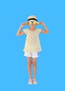 Portrait asian little child girl wearing sunglasses and straw hat over light blue background isolated with clipping path. Summer Royalty Free Stock Photo