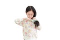 Portrait asian little girl combing long hair on white. Hair care concept Royalty Free Stock Photo